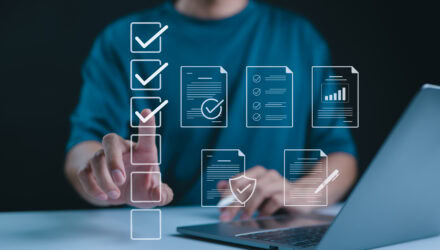 Business person using digital checklists and data analysis tools for project management.