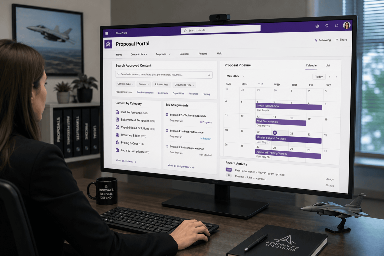 Business Professional Reviewing a Request Form | i3solutions Business professional reviewing a request form on a desktop monitor in an office.