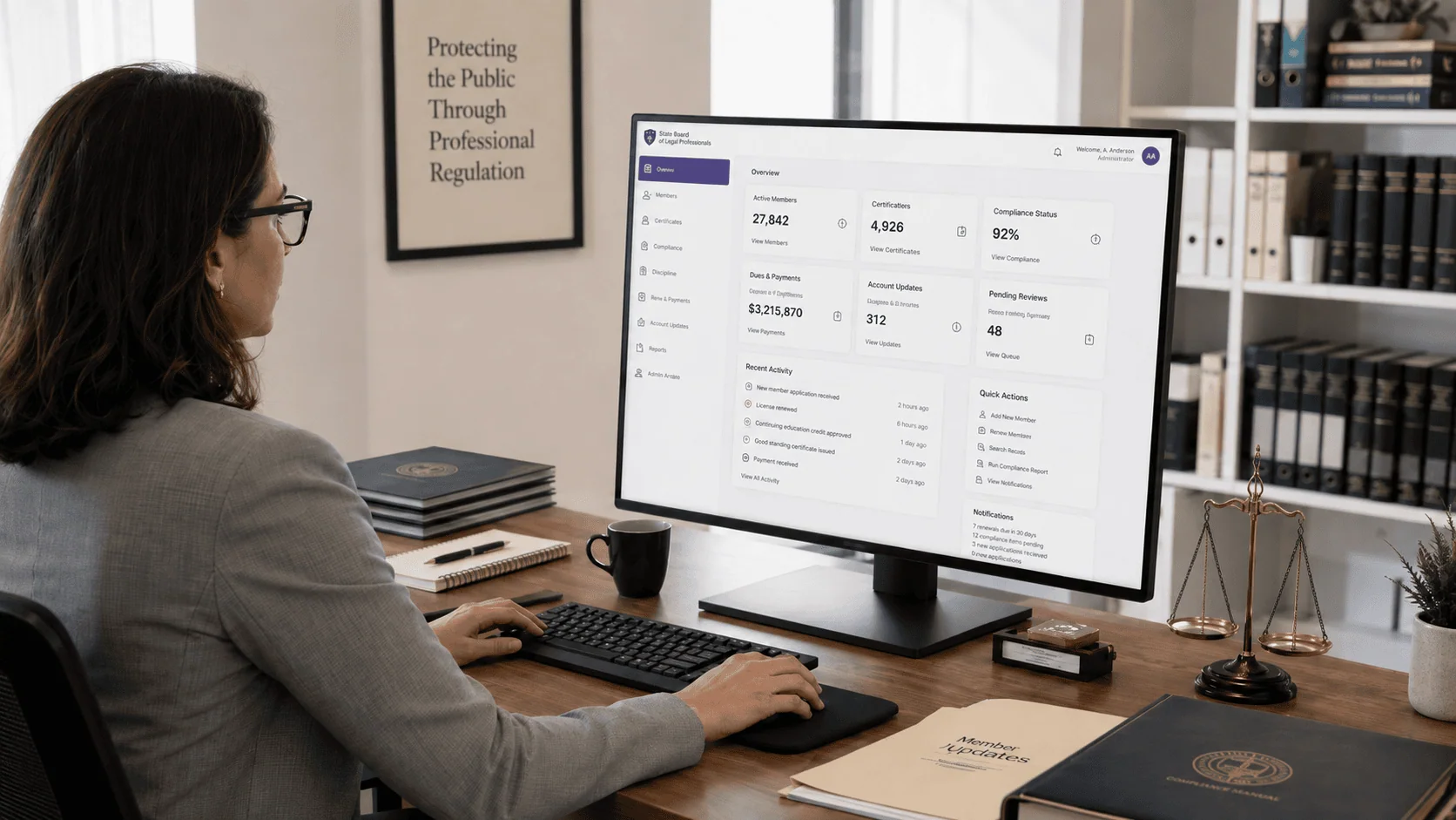 Businesswoman Reviewing Membership Records on a Desktop | i3solutions Businesswoman reviewing membership records on a desktop monitor.