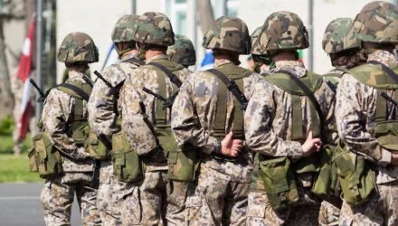 Military Soldiers in Camouflage Uniforms Standing | i3solutions Military soldiers in camouflage uniforms standing in formation outdoors.