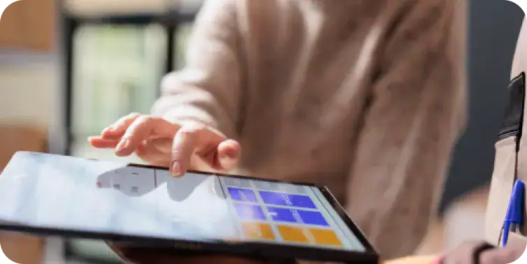 Business Meeting with Digital Tablet Person using a digital tablet during a business meeting or discussion.
