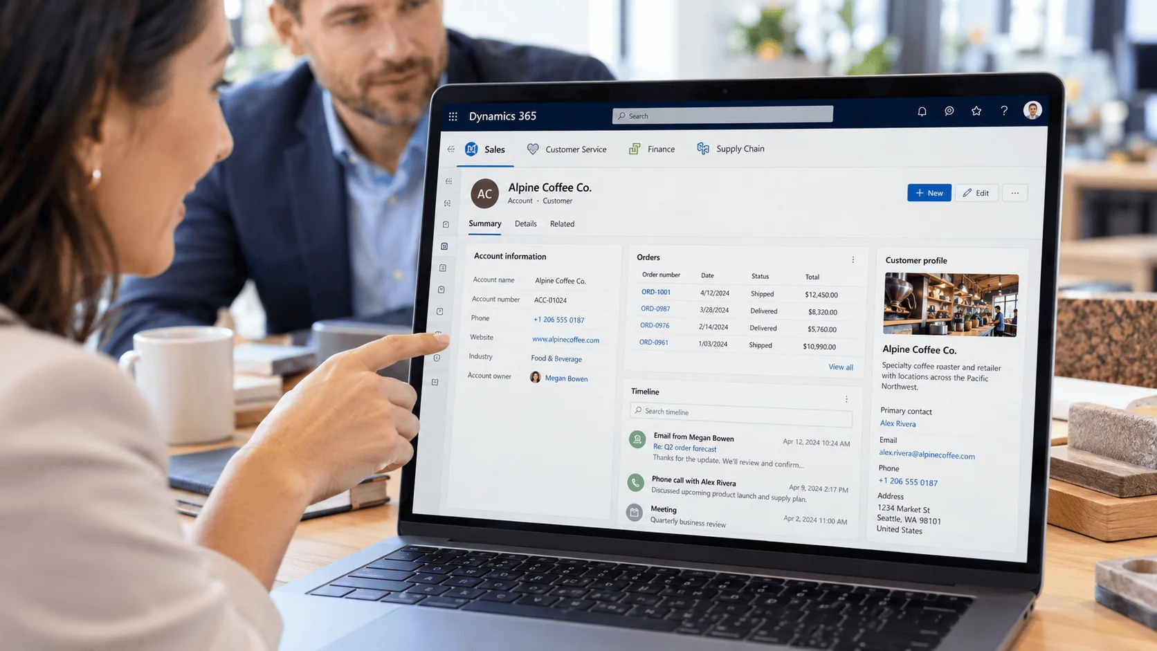 Laptop showing Dynamics 365 with Sales, Customer Service, Finance, and Supply Chain modules and a customer record timeline. | i3solutions Laptop showing Dynamics 365 with Sales, Customer Service, Finance, and Supply Chain modules and a customer record timeline.